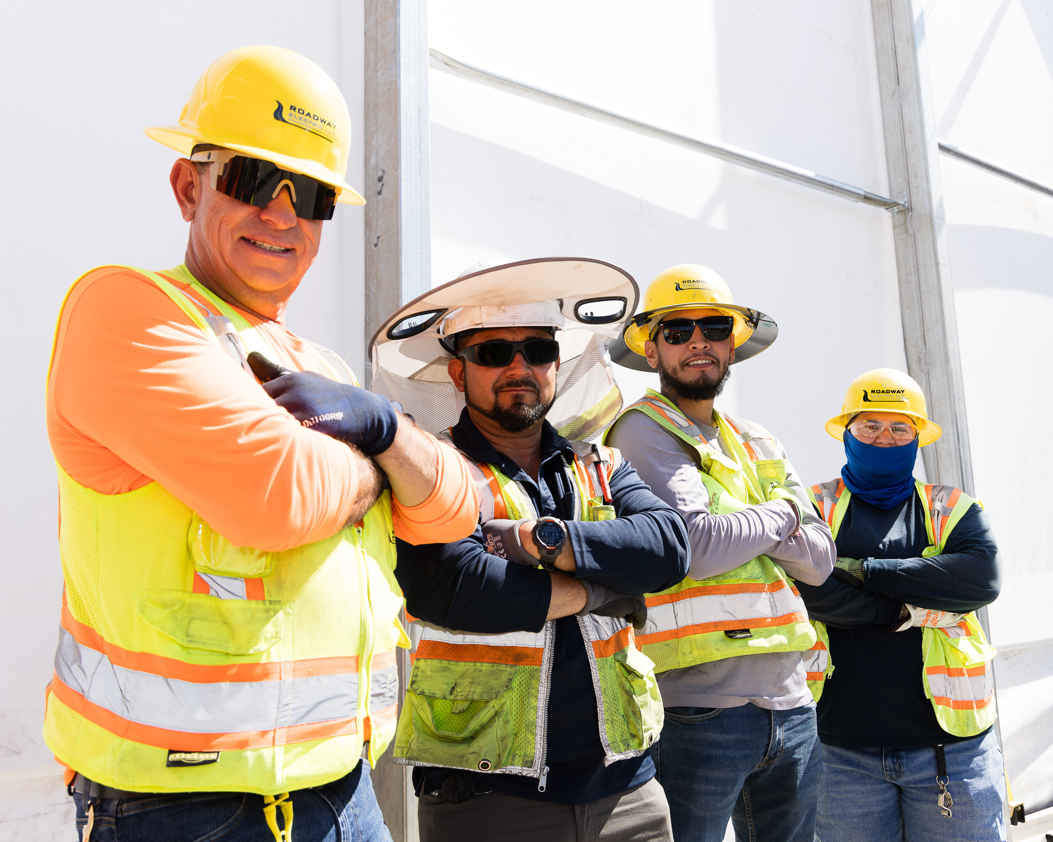 Three men and one woman in PPE